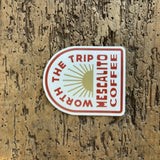 Shop Stickers by Mescalito Coffee featuring "WORTH THE TRIP MESCALITO COFFEE" and a sunburst design—ideal for collectors or fans of unique small town coffee shop merchandise.