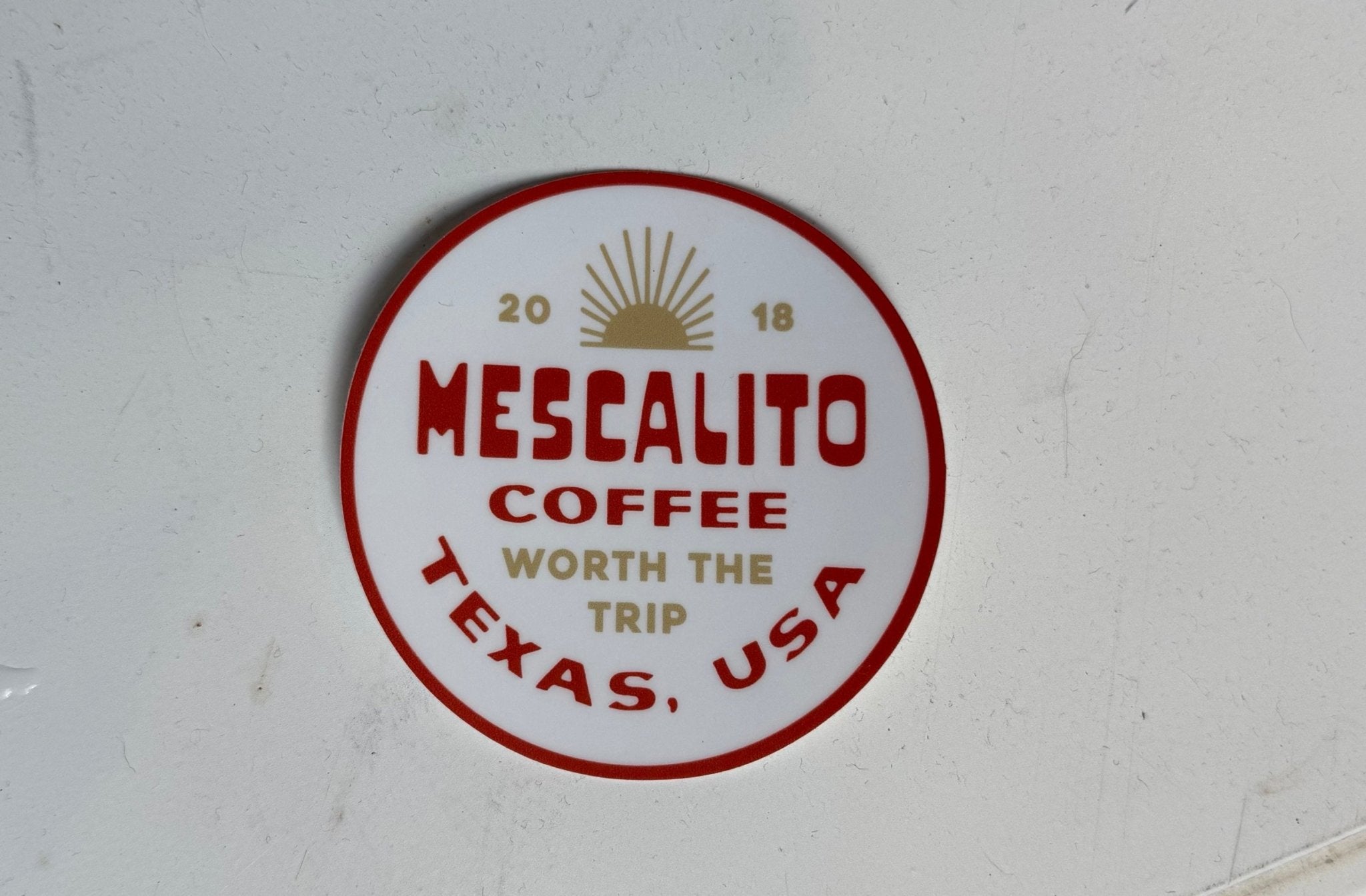 Mescalito Coffee's Shop Stickers feature red and gold text "Worth the Trip, Texas, USA," a sun graphic, and 2018—perfect collectible decor for small town coffee lovers.