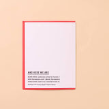 The "Shrimply Obsessed With You" greeting card by And Here We Are features a red border, the text "AND HERE WE ARE," and printing details with a website at the bottom, all set against a beige background.