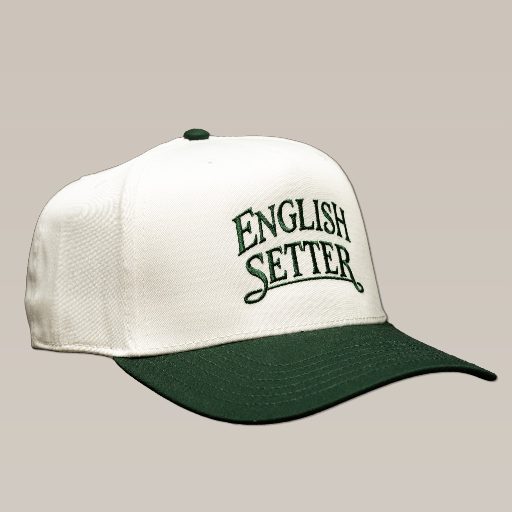White Bird Dog Series Hat | English Setter baseball cap with a dark green brim and “English Setter” embroidered in dark green on the front.