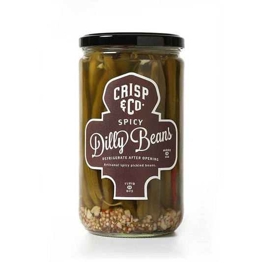 A jar of Crisp & Co. Spicy Dilly Beans, with visible beans and spices inside, sports a dark label and black lid—perfect as a healthy snack or zesty Bloody Mary garnish.