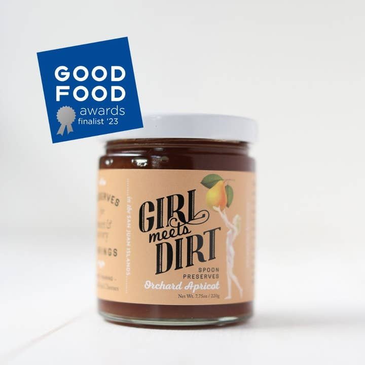 A jar of Girl Meets Dirt Spoon Preserves, an artisanal spread and Good Food Awards 2023 finalist, is featured.