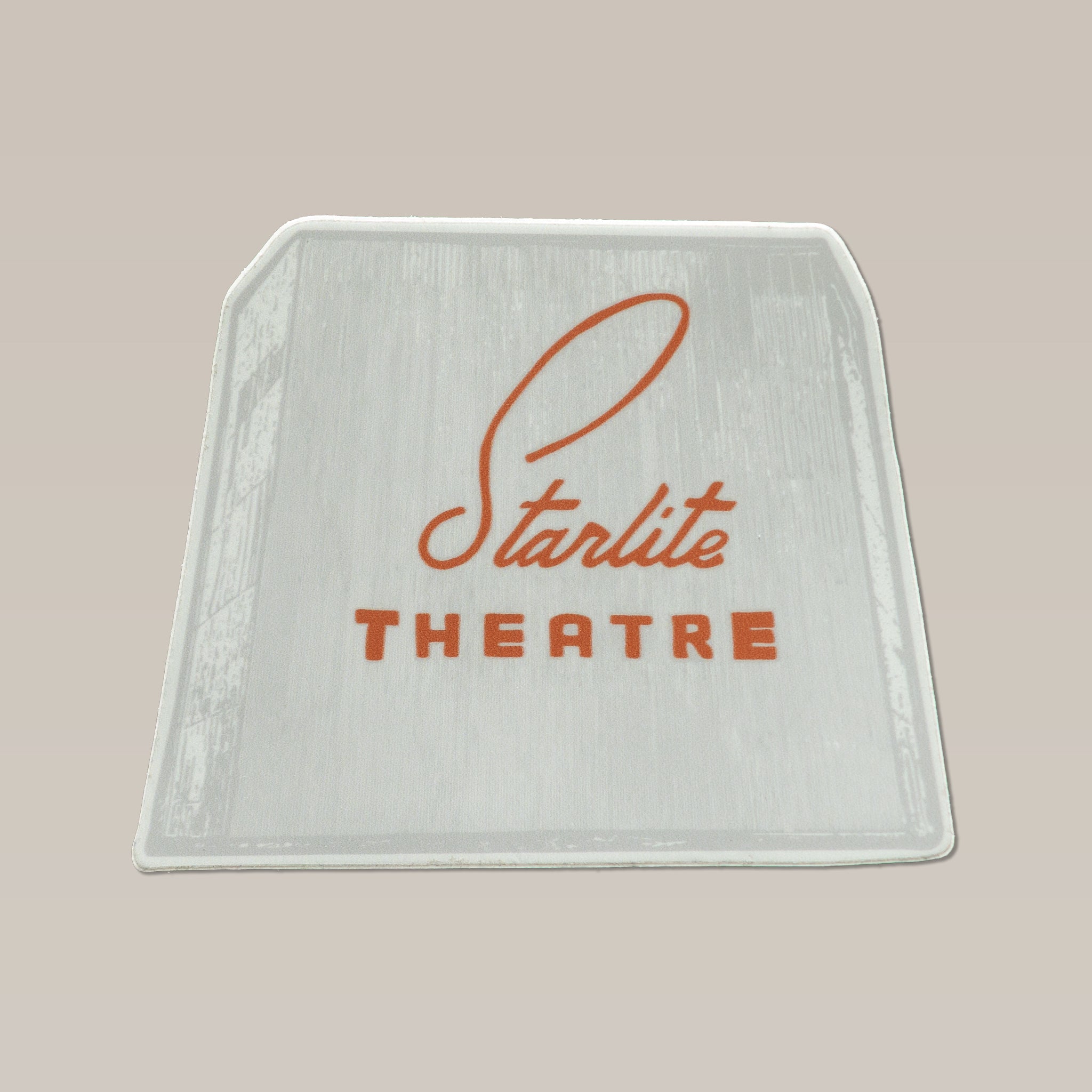 The Shop Sticker | Starlite Theatre by Ballad of the Bird Dog features “Starlite Theatre” in orange script and block letters on a light gradient, inspired by the iconic landmark—perfect for decorating cards, laptops, or notebooks.