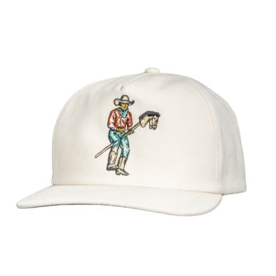 The Stick Horse Hat by Sendero Provisions Co. is a white baseball cap with an embroidered cowboy holding a stick horse on the front panel.