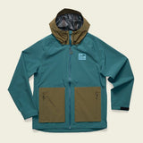 The Howler Brothers Storm Splitter Rain Shell features a teal and olive green waterproof design with two front zip pockets, a front zipper, and a light blue rectangular chest patch.
