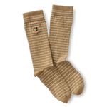 The Duck Head Striped Logo Sock features tan and white horizontal stripes, a green cactus patch on one sock, and the signature embroidered Duck Head logo.