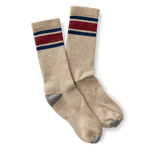 The Striped Sock by Duck Head is a beige pair with blue and red stripes at the top, plus gray toes and heels, shown on a white background.