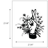 The Jenni Earle Temporary Tattoos feature a black and white hand with crossed fingers amid foliage, evoking a Western feel. Non-toxic and sized 2.25"x2.25", dimensions shown by arrows. Brand: Jenni Earle.