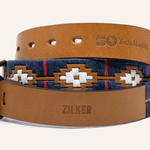 Two tan Argentine leather Zilker Belts: one for Texas Monthly’s 50th Anniversary and a limited edition with "Zilker" and blue, white, and red geometric patterns.