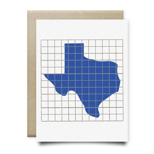 The Texas Shape | Houston Blue Tile Greeting Card by Anvil Cards features a hand-drawn blue Texas silhouette on a gray grid, printed on sustainable linen paper, A2 size, and includes a brown envelope.