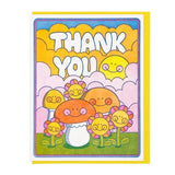 The "Thank You Mushroom and Flowers" card by Lucky Horse Press features a cheerful sun, smiling mushrooms, and flowers on grass with clouds. Letterpress printed on recycled cover; blank inside for your message.