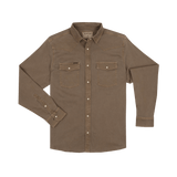 The Cotulla | Poncho by Poncho is a western-inspired khaki long-sleeve button-up shirt with two front chest pockets, buttoned cuffs, and a pointed collar, shown laid flat on a white background.