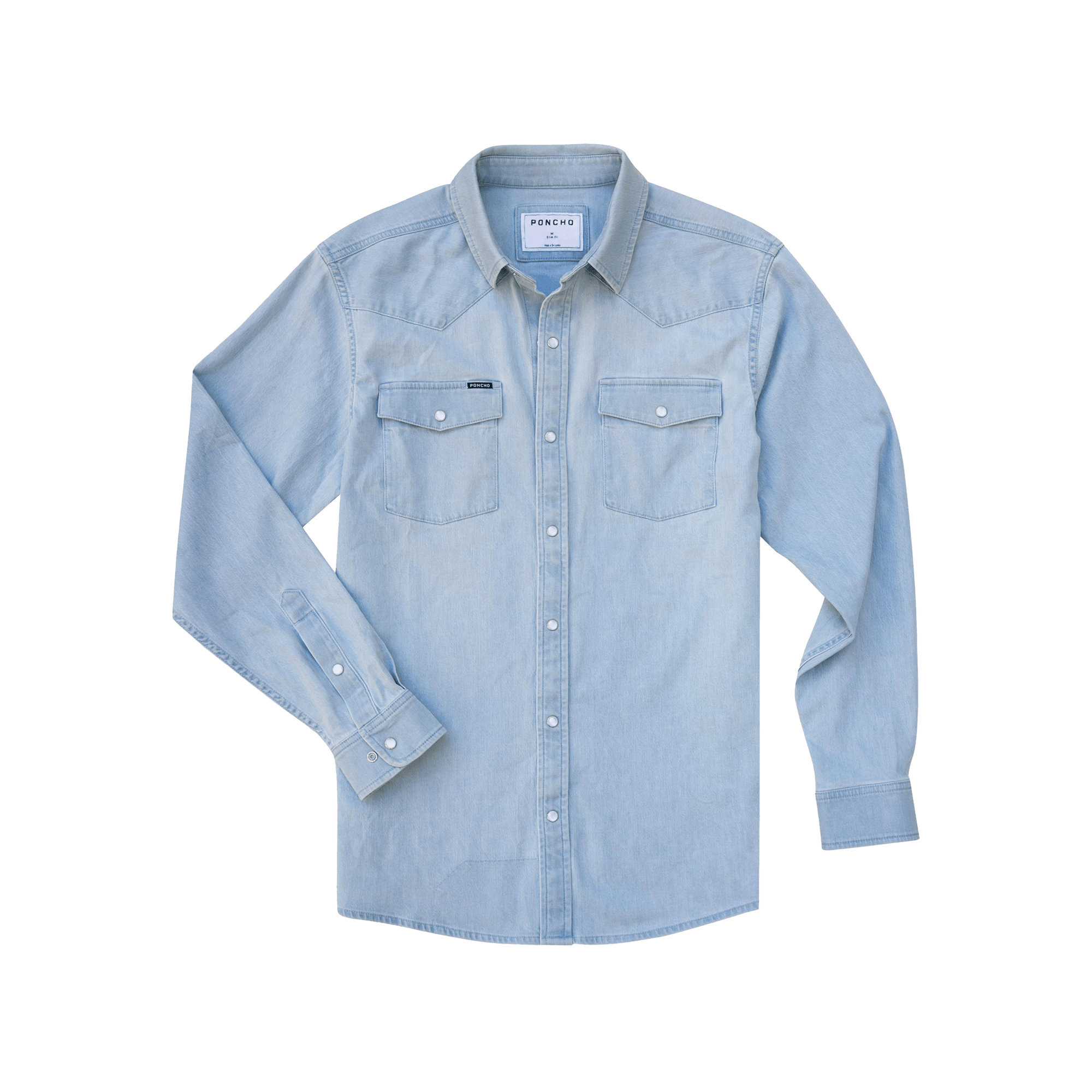 The Marfa | Poncho by Poncho: Light blue western performance denim long-sleeve shirt with button-down front, two chest flap pockets, durable stitching, and buttoned cuffs, shown laid flat on a white background.