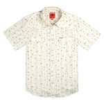 The Wyatt Pearl Snap Dustbloom by Sendero Provisions Co. is a cream short-sleeve western shirt with a small floral print, pearl snaps, button-up front, and two chest pockets.