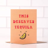 Send sunny, California vibes with the “This Deserves Tequila” card by Daydream Prints, featuring bold red lettering and a lime wedge illustration—perfect for cheerful greetings.