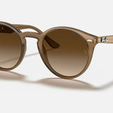 Ray-Ban Turtledove sunglasses with brown gradient lenses, dark brown transparent frames, and silver temple accents.