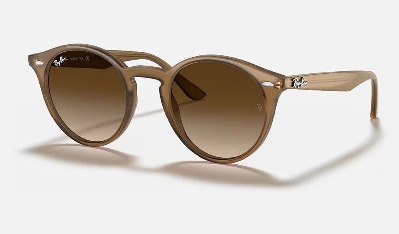 Ray-Ban Turtledove sunglasses with brown gradient lenses, dark brown transparent frames, and silver temple accents.