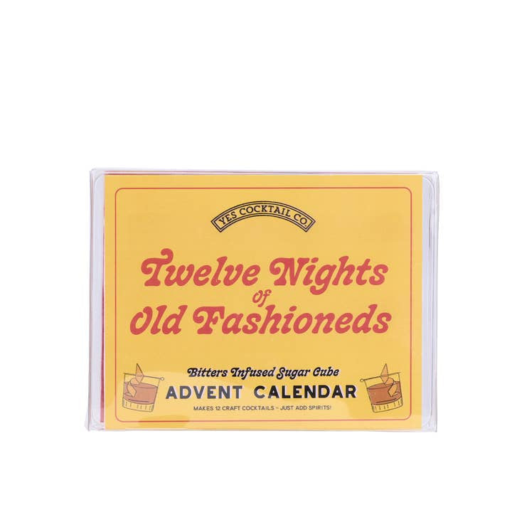 The Twelve Nights of Old Fashioneds from Yes Cocktail Co. is a yellow box Advent Calendar featuring unique bitters-infused sugar cubes for whiskey cocktail lovers—perfect for enjoying a new Old Fashioned each night.