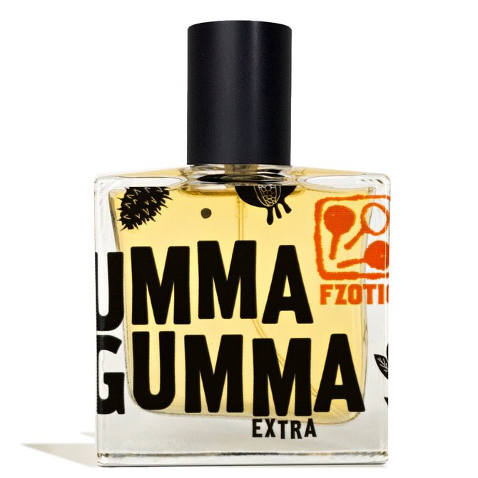 A rectangular glass perfume bottle labeled "Ummagumma Extra EDP | Fzotic" with a black cap and bold black and orange text, this Fzotic fragrance offers hints of smoky dark chocolate on a clean white background.