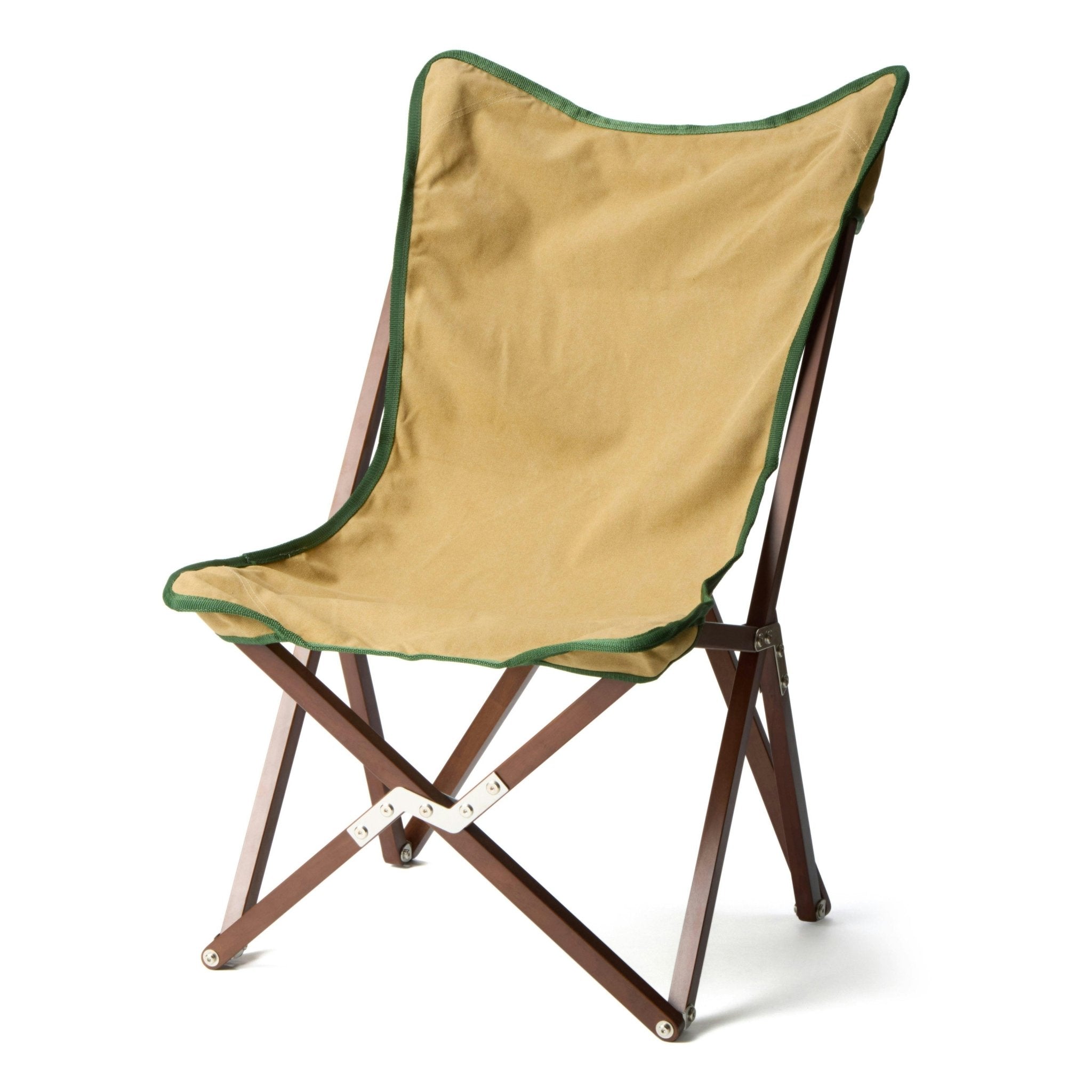 The Vaquero Chair by Chama Chairs features a tan fabric seat, green trim, and a wooden frame, displayed against a plain white background.