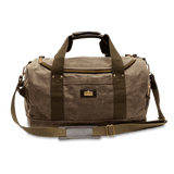 The Duck Head Waxed Canvas Overnighter Bag in Field Brown features olive green straps, a front pocket, brass hardware, and a detachable shoulder strap—ideal as a travel bag, shown against a white background.