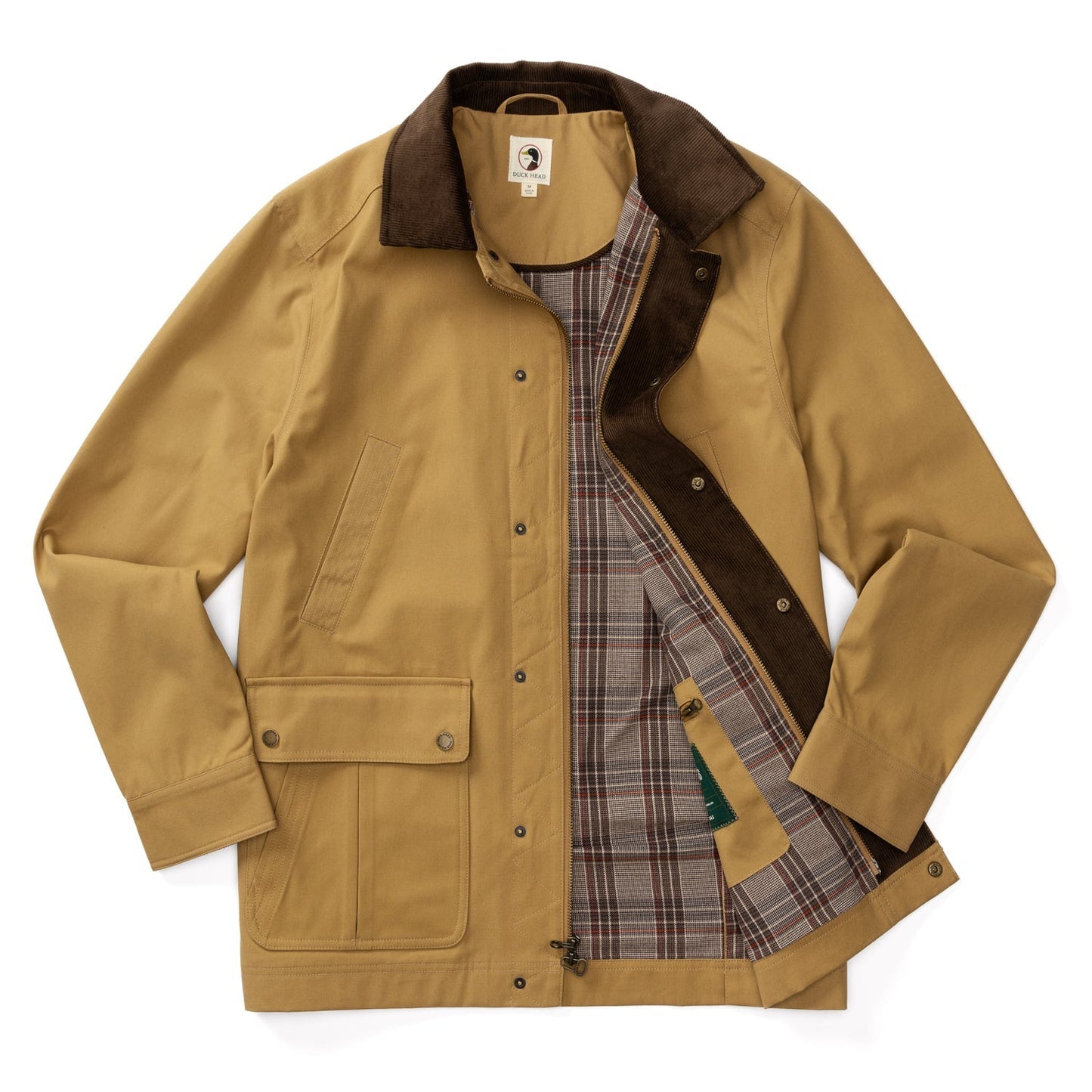The Duck Head Waxed Duck Canvas Jacket features a tan waxed finish, dark brown collar, plaid lining, flap and slit pockets, and snap button closures, shown laid flat with the front partially open.