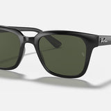 A pair of Ray-Ban 0707 Wayfarer sunglasses with black rectangular frames and dark green lenses, made from lightweight plastic, displayed on a light gray background.