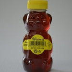 A plastic bear-shaped bottle filled with Pure Local Honey from R. Weaver Apiaries, sealed with a yellow cap and labeled "Weaver's Honey | R. Weaver Apiaries" along with product information.