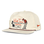 The West Texas Municipal Hat by Sendero Provisions Co. is a cream 5-panel pop-up cap with "West Texas Sendero Provisions Co.," an embroidered figure, desert scene on the front, quick-dry nylon fabric, and paracord rope detail for style.