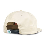 The Sendero Provisions Co. West Texas Municipal Hat is a beige 5-panel cap, shown from the back with an adjustable black snap closure, paracord rope embroidery, and a small green leaf logo tag.