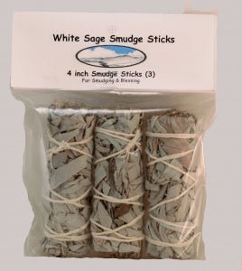 A plastic package of three 4-inch Taos Herb Co. White Sage Smudge Sticks (Salvia Apiana), wrapped with string, labeled "White Sage Smudge Stick | Taos Herb Co."—perfect for smudging and blessing.