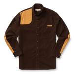 The Duck Head Woodland Shooting Shirt is a dark brown, stretch twill, long-sleeve button-up with tan quilted recoil patches on the right shoulder, left elbow, and left sleeve, plus a chest pocket with a "Duck Head" label.