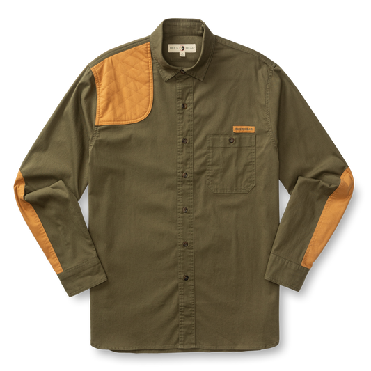 The Duck Head Woodland Shooting Shirt is an olive green long-sleeve top with tan quilted shoulder and elbow patches, a chest pocket, and button front, crafted from durable stretch twill outdoor fabric. Laid flat on a white background.