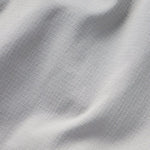 Close-up of the W's Gulf Pants by Duck Camp, featuring light gray or white textured fabric with a visible weave pattern and gentle folds.