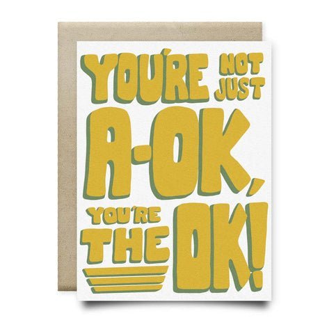 The You're Not Just A-OK Card by Anvil Cards features bold yellow and green text on linen paper, is A2 size, blank inside, and includes a brown envelope.