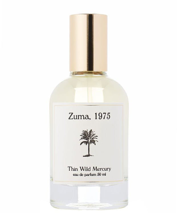 A clear glass perfume bottle with a gold cap, labeled "Zuma | Thin Wild Mercury" by Thin Wild Mercury (50 ml), features a black palm tree and contains a Malibu-inspired ocean scent.