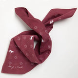 The Jenni Earle "Blaze A Trail" Bandana is hand-dyed maroon with white horse and geometric patterns, plus "Blaze a Trail" printed in one corner.