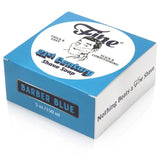A blue and white box of Fine Accoutrements' Barber Blue 21C Shave Soap, 5 oz, showcases retro branding and highlights a barbershop scent with tallow base for superior shaving.