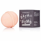 A peach-hued Bath Bomb | Bergamot + Grapefruit by Old Whaling Co. rests beside its box, combining citrus notes and Epsom salts for a refreshing bath experience.