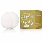 A white bath bomb with epsom salts rests by a green "Bath Bomb | Coconut Milk | Old Whaling Co." box from Old Whaling Co., offering a soothing soak.