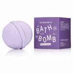 A lavender bath bomb rests beside a purple box labeled "Bath Bomb | French Lavender | Old Whaling Co." by Old Whaling Co., crafted with epsom salt for soothing, relaxing soaks.