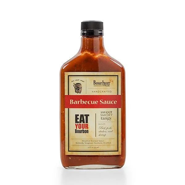 A bottle of BBQ Sauce from Bourbon Barrel Foods, "Eat Your Bourbon," features sweet, smoky, tangy notes and rich bourbon smoked flavors inspired by authentic Kentucky Bourbon.