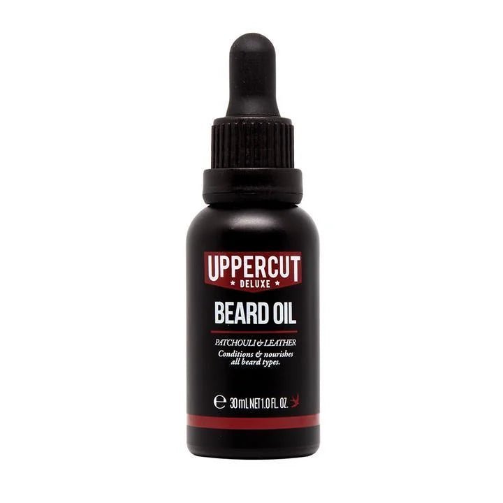 Uppercut Deluxe Beard Oil (30ml) with dropper cap in "Patchouli & Leather" scent conditions and softens all beard types for nourishment.