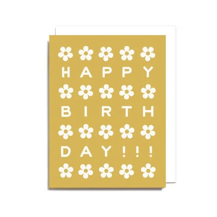 The Birthday Daisies Card by Worthwhile Paper is a recycled yellow card with white daisies and "HAPPY BIRTHDAY!!!" in white, all arranged in a charming grid.