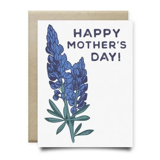 The Bluebonnet Mother's Day Card by Anvil Cards is an A2 linen paper card with "Happy Mother's Day!" and two bluebonnets on the front, paired with a brown envelope and left blank inside for your message.