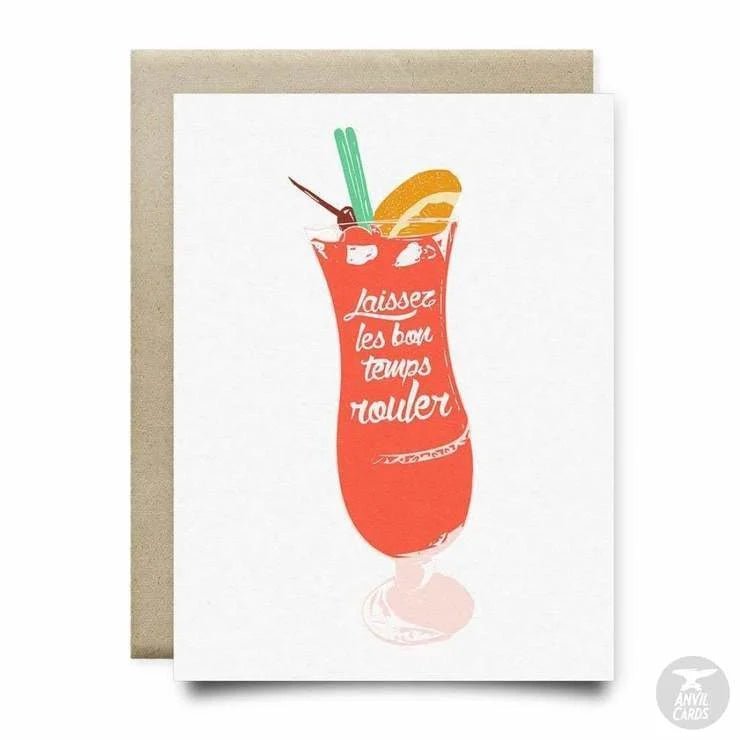 The Bon Temps Rouler Card by Anvil Cards is an A2 linen paper greeting card featuring a red cocktail with fruit and “Laissez les bon temps rouler” on the glass. Blank inside for your personal message.