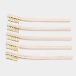 The Otter Wax Brass Cleaning Brush features short brass bristles and a wooden ergonomic handle—ideal for cleaning canvas and suede.