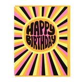 Send sunny birthday wishes with the Happy Birthday Sunburst card by Lucky Horse Press, featuring bold retro lettering in a yellow circle with pink, black, and yellow radiating stripes. Blank inside for your message.