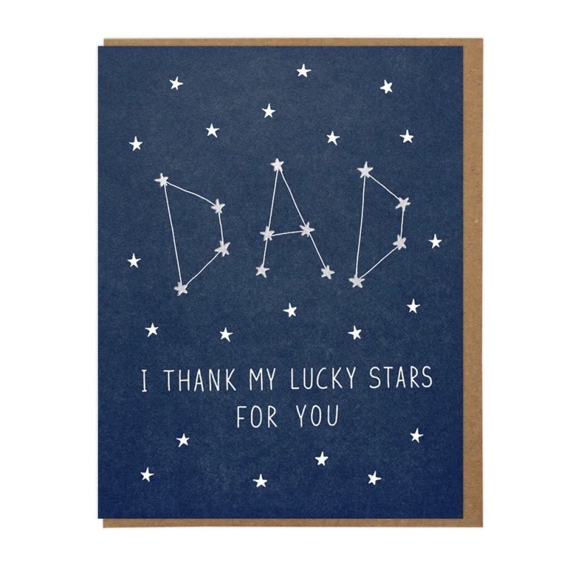 The Lucky Stars Dad greeting card by Lucky Horse Press features white stars forming "DAD" as constellations with "I THANK MY LUCKY STARS FOR YOU" on a dark blue background. Letterpress printed on recycled cover and made in the USA.