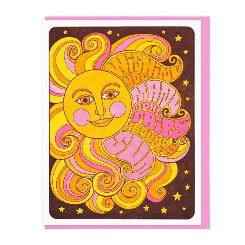 The "Many More Trips Around The Sun" card by Lucky Horse Press features a retro sun, yellow and pink text, and stars on a brown background. Blank inside for your message.